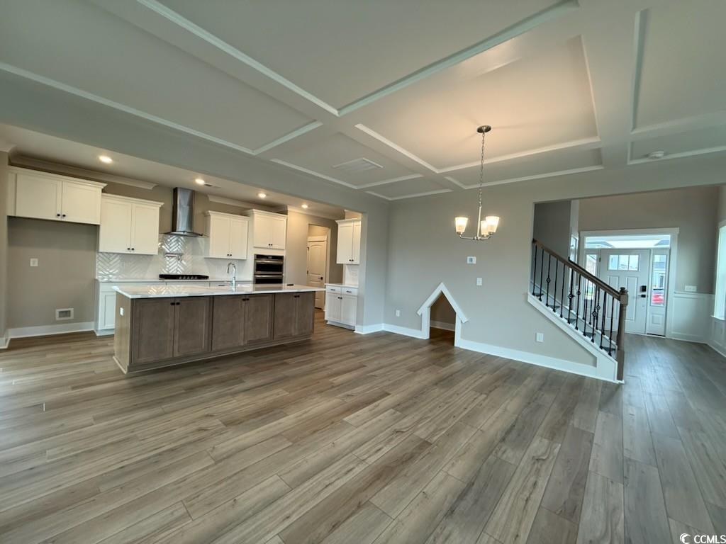4019 Bucolic Loop Myrtle Beach, SC 29588 - Photo 3 of 31 Kitchen featuring wall chimney range hood, coffere