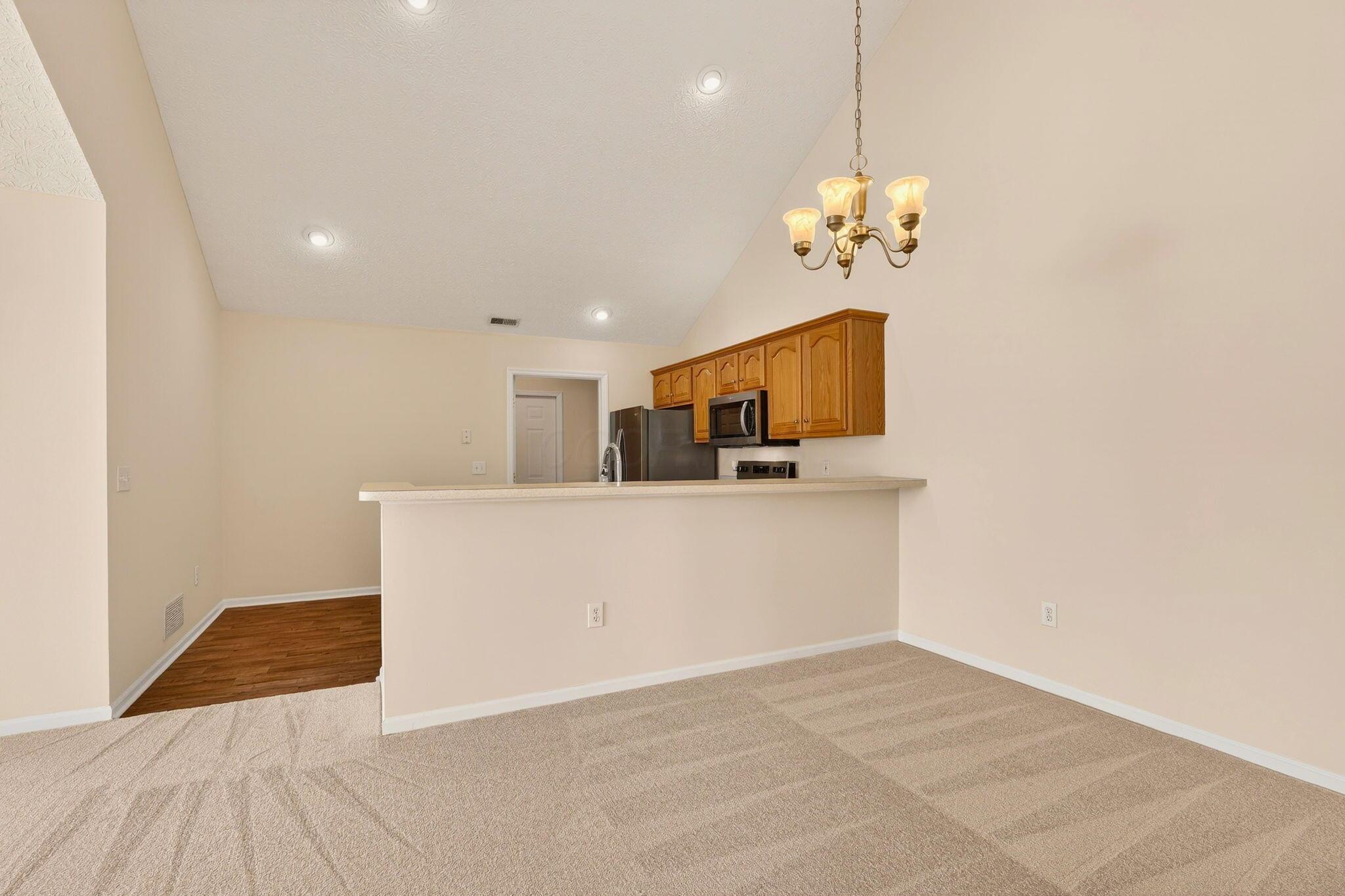 3731 Stoneway Point Powell, OH 43065 - Photo 19 of 47 Raised bar between kitchen & dining