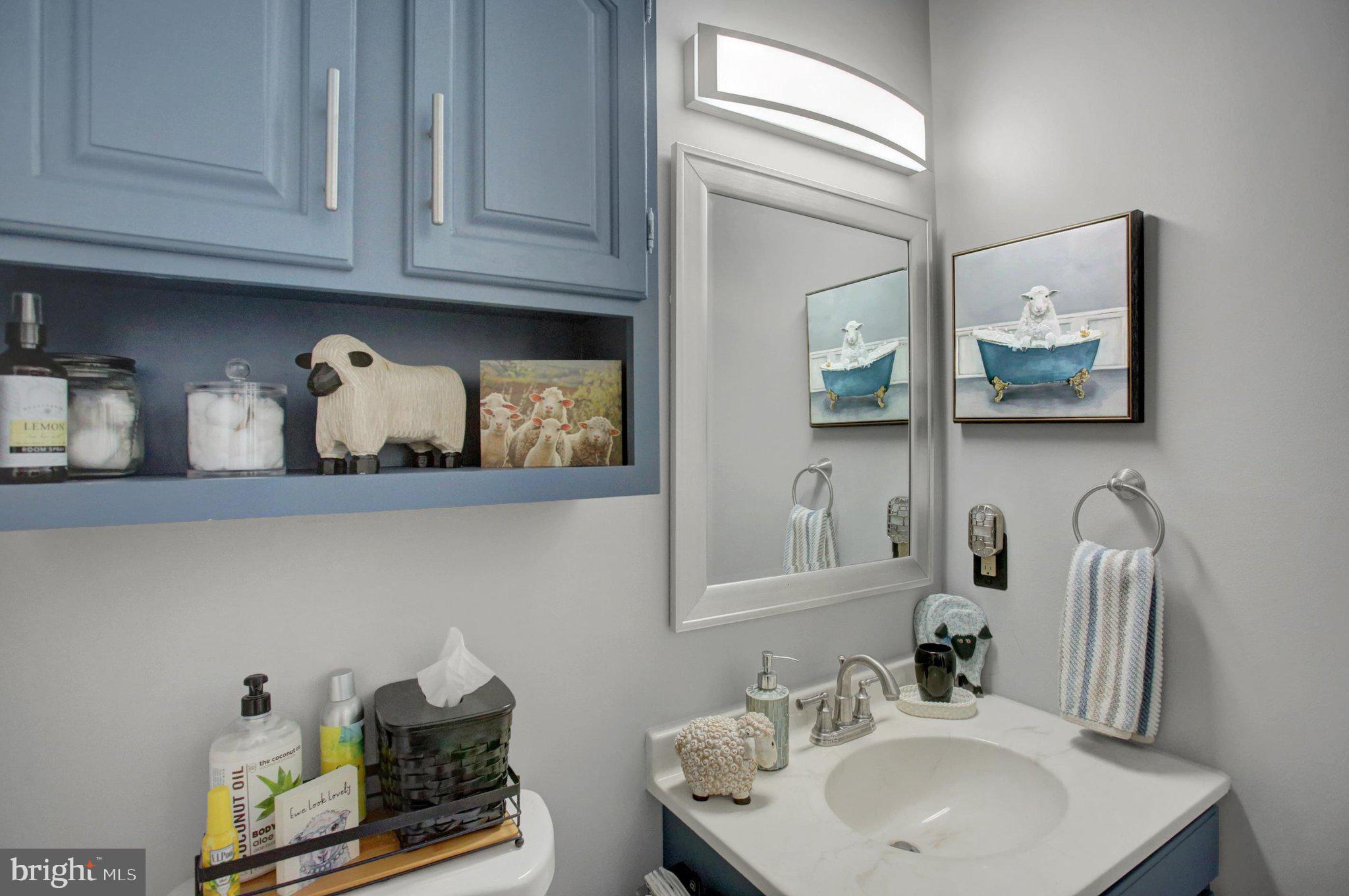 11086 Welsh Run Road Greencastle, PA 17225 - Photo 30 of 63 a bathroom with a sink and a mirror
