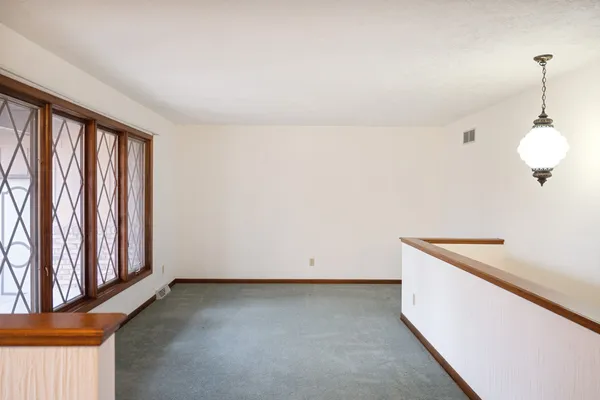 a view of a storage and utility room with windows