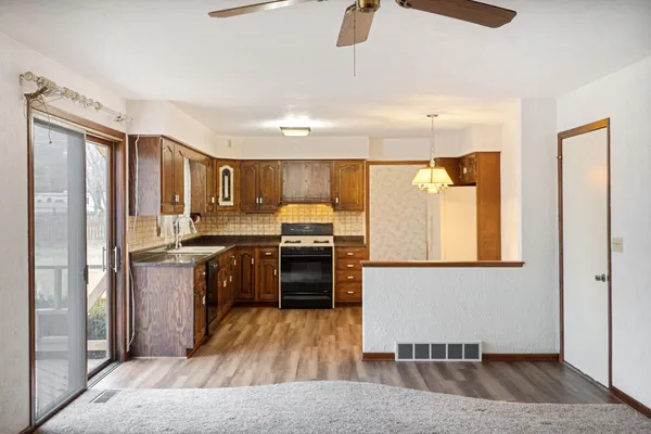 a kitchen with a refrigerator and a sink