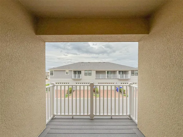 an empty room with a mirror and a shower