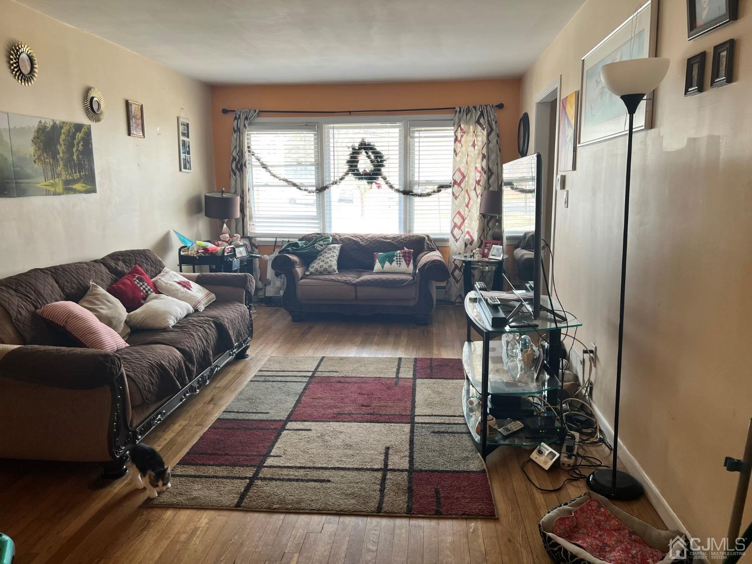 3 Violet Place Edison, NJ 08817 - Photo 3 of 4 a living room with furniture and a large window