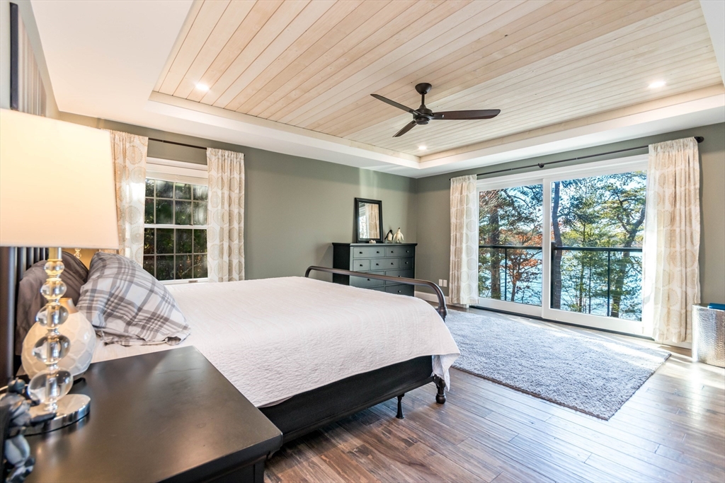 2 Blackmore Pond Circle Wareham, MA 02576 - Photo 19 of 42 a bedroom with a large bed and a large window