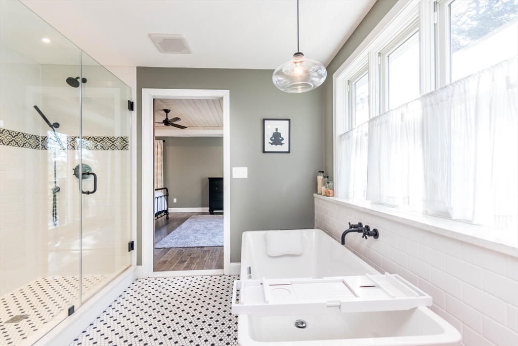 2 Blackmore Pond Circle Wareham, MA 02576 - Photo 22 of 42 a bathroom with a tub sink and shower