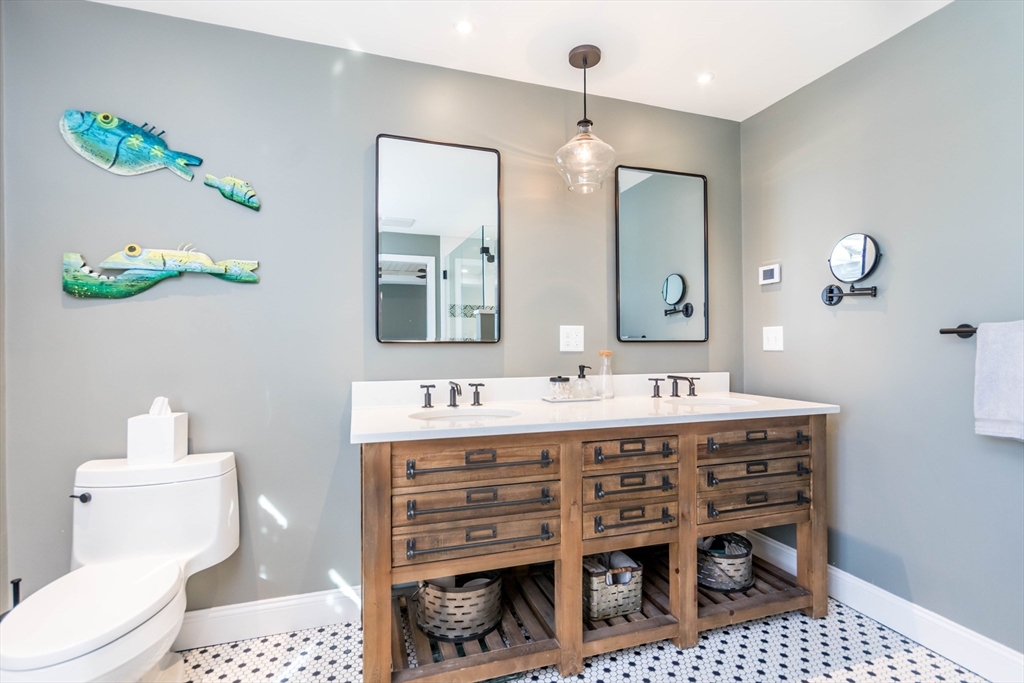 2 Blackmore Pond Circle Wareham, MA 02576 - Photo 23 of 42 a bathroom with a sink a vanity and a mirror