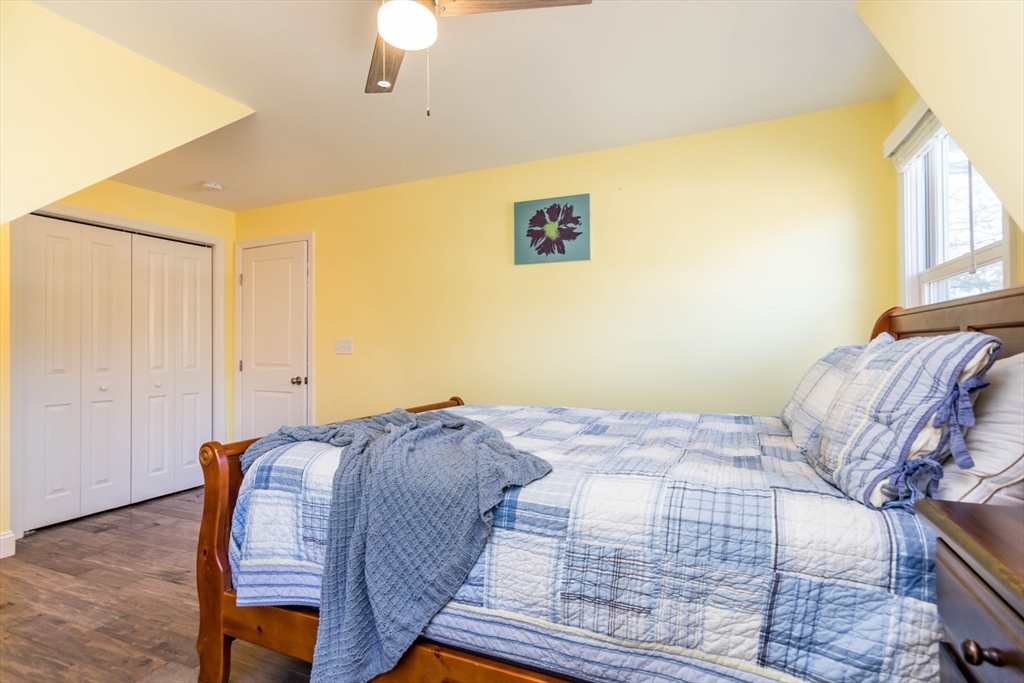 2 Blackmore Pond Circle Wareham, MA 02576 - Photo 28 of 42 a bed sitting in a bedroom next to a window