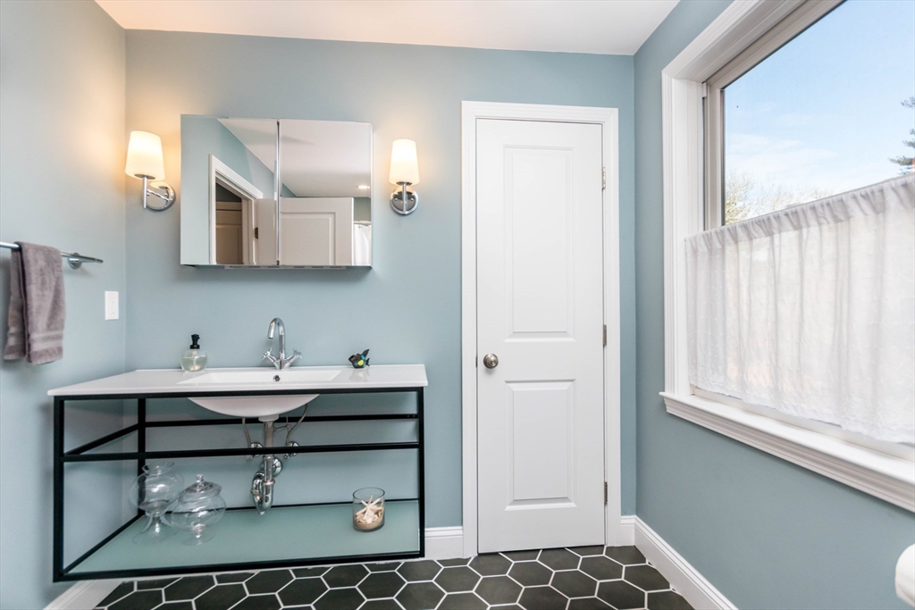 2 Blackmore Pond Circle Wareham, MA 02576 - Photo 29 of 42 a bathroom with a sink and a mirror