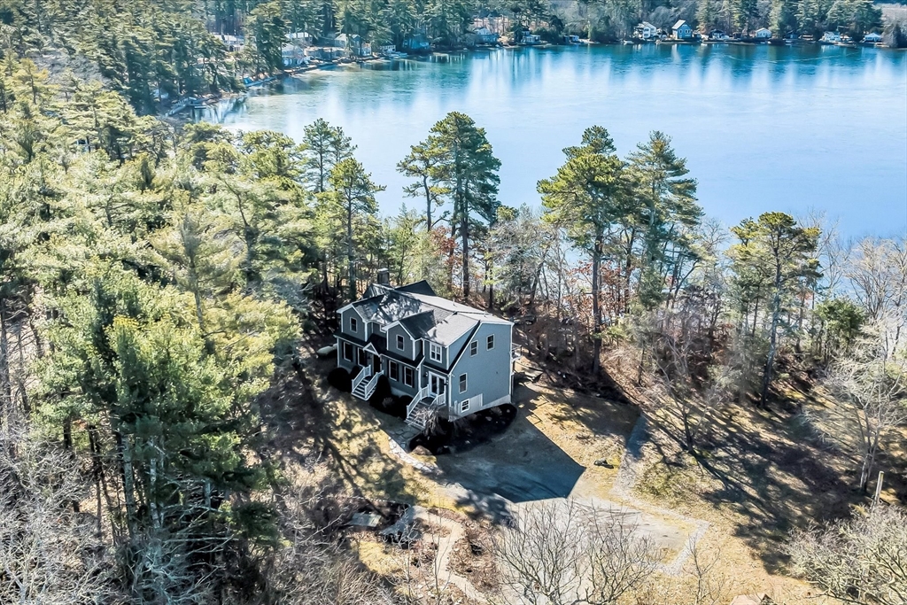 2 Blackmore Pond Circle Wareham, MA 02576 - Photo 3 of 42 a view of a lake with houses