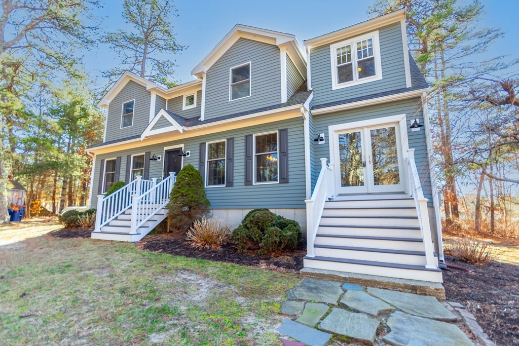 2 Blackmore Pond Circle Wareham, MA 02576 - Photo 36 of 42 a front view of a house with a yard