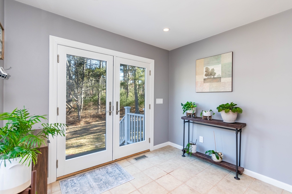 2 Blackmore Pond Circle Wareham, MA 02576 - Photo 4 of 42 a room with garden view and floor to ceiling window