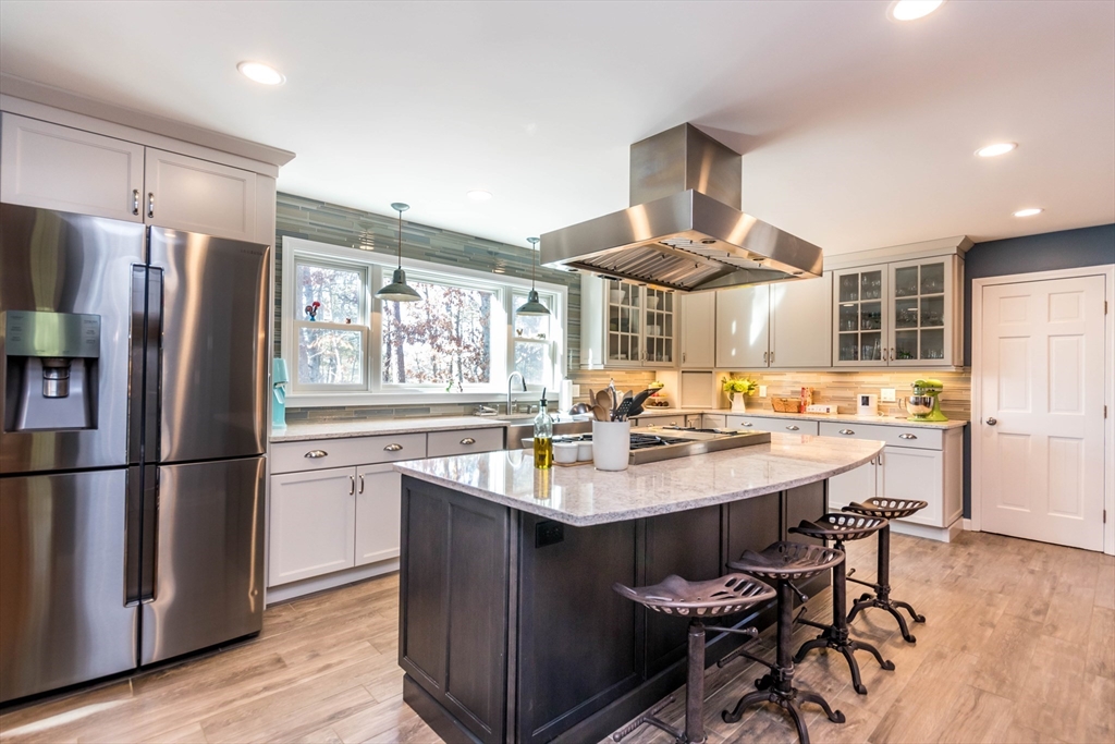 2 Blackmore Pond Circle Wareham, MA 02576 - Photo 7 of 42 a kitchen with stainless steel appliances granite countertop a sink stove and refrigerator