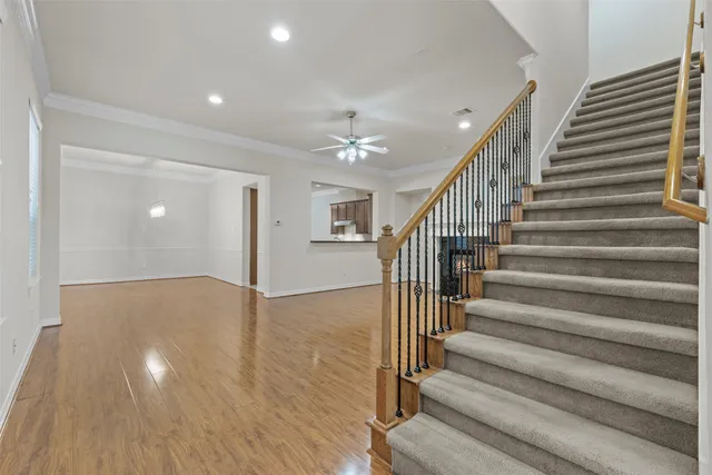 a view of entryway and hall with wooden floor
