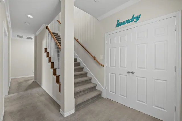 a view of a hallway with staircase