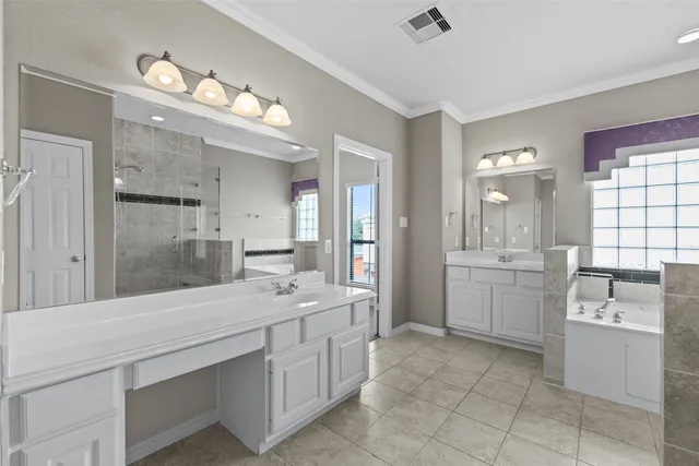 a bathroom with a sink a toilet a mirror and shower