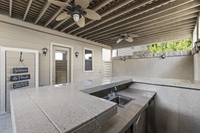 a view of a storage & utility room with a sink