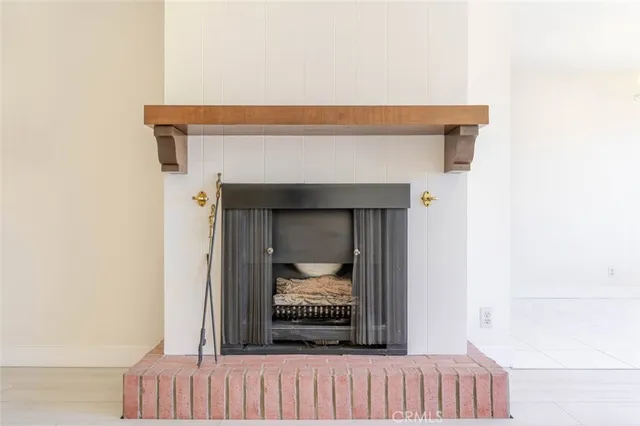 a large white kitchen with a large window