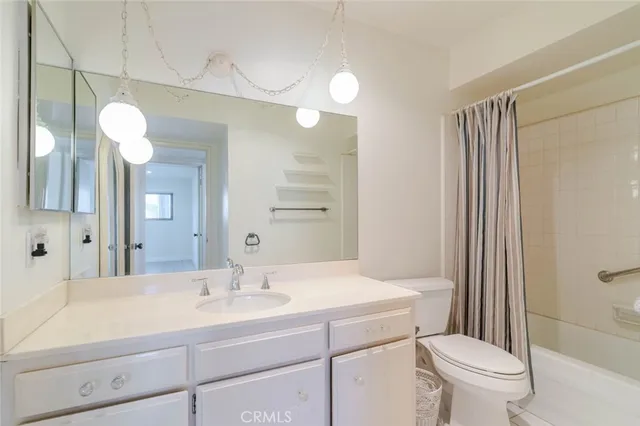 a bathroom with a shower and a toilet