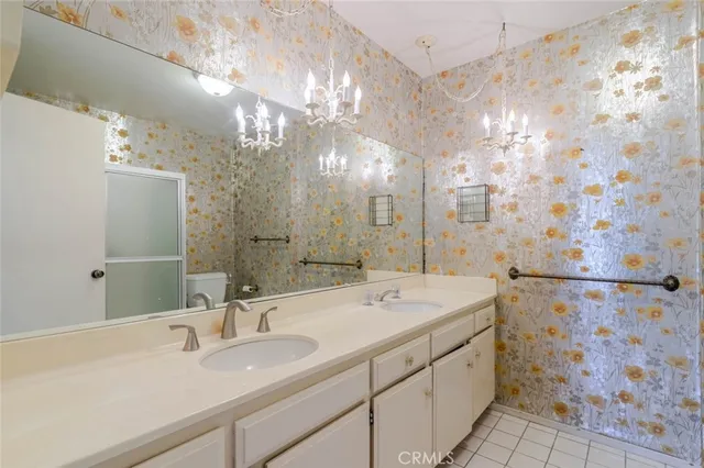 a bathroom with a shower and a mirror