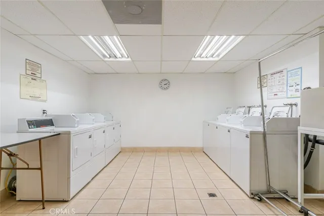 a view of backyard with a swimming pool and outdoor seating