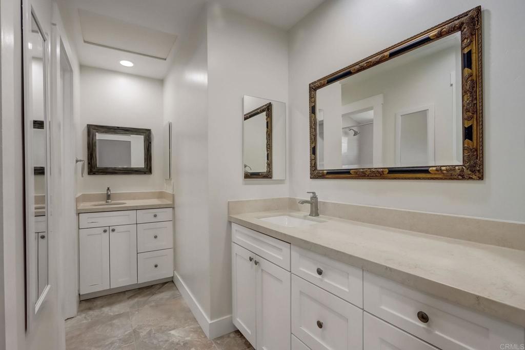 2035 Waterbury Chula Vista, CA 91913 - Photo 12 of 26 a bathroom with a toilet a sink and mirror