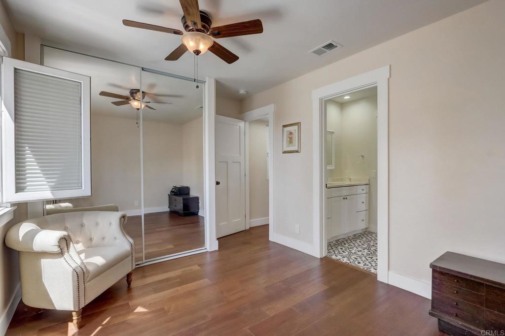 2035 Waterbury Chula Vista, CA 91913 - Photo 16 of 26 a view of a livingroom with a couch and a ceiling fan