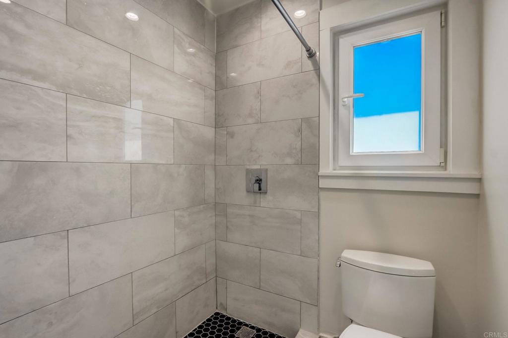 2035 Waterbury Chula Vista, CA 91913 - Photo 18 of 26 a bathroom with a toilet and a shower