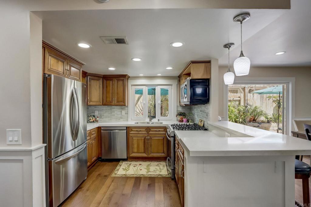 2035 Waterbury Chula Vista, CA 91913 - Photo 6 of 26 a kitchen with stainless steel appliances granite countertop a sink stove and refrigerator
