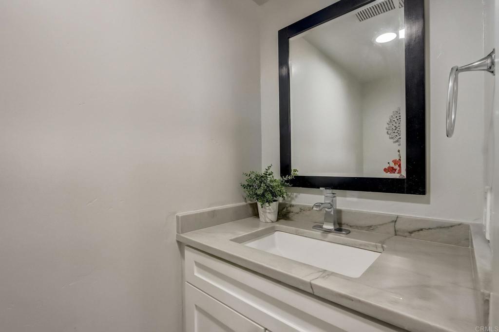 2035 Waterbury Chula Vista, CA 91913 - Photo 9 of 26 a bathroom with a sink and a mirror