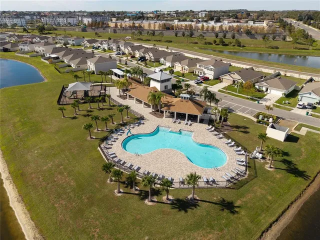 an aerial view of a house with a lake view