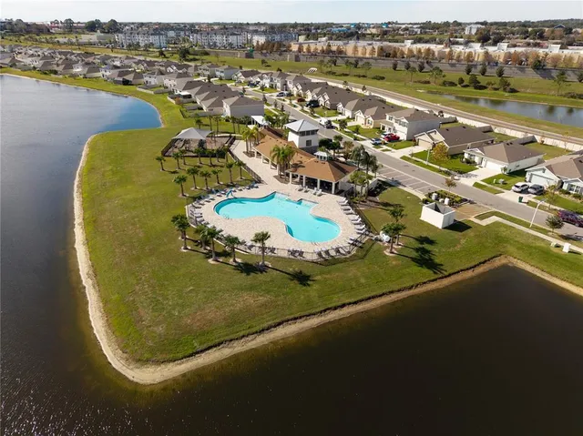 an aerial view of a residential houses with outdoor space