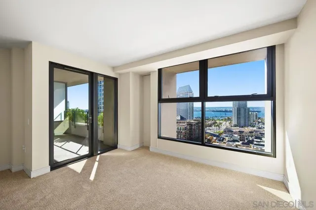 a view of an empty room with a window