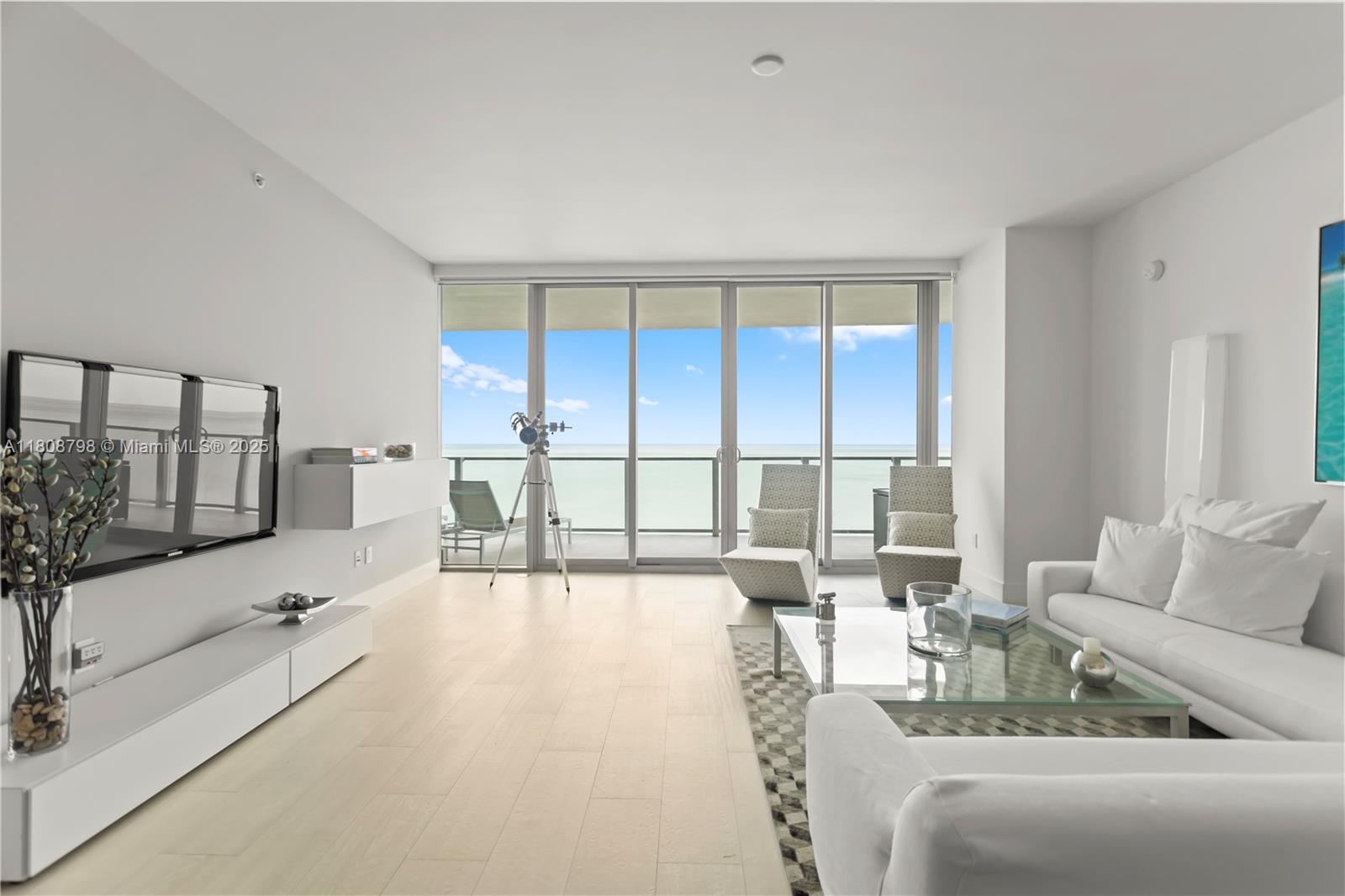 350 Ocean Drive, Unit 904N Key Biscayne, FL 33149 - Photo 21 of 41 a living room with furniture and a large window