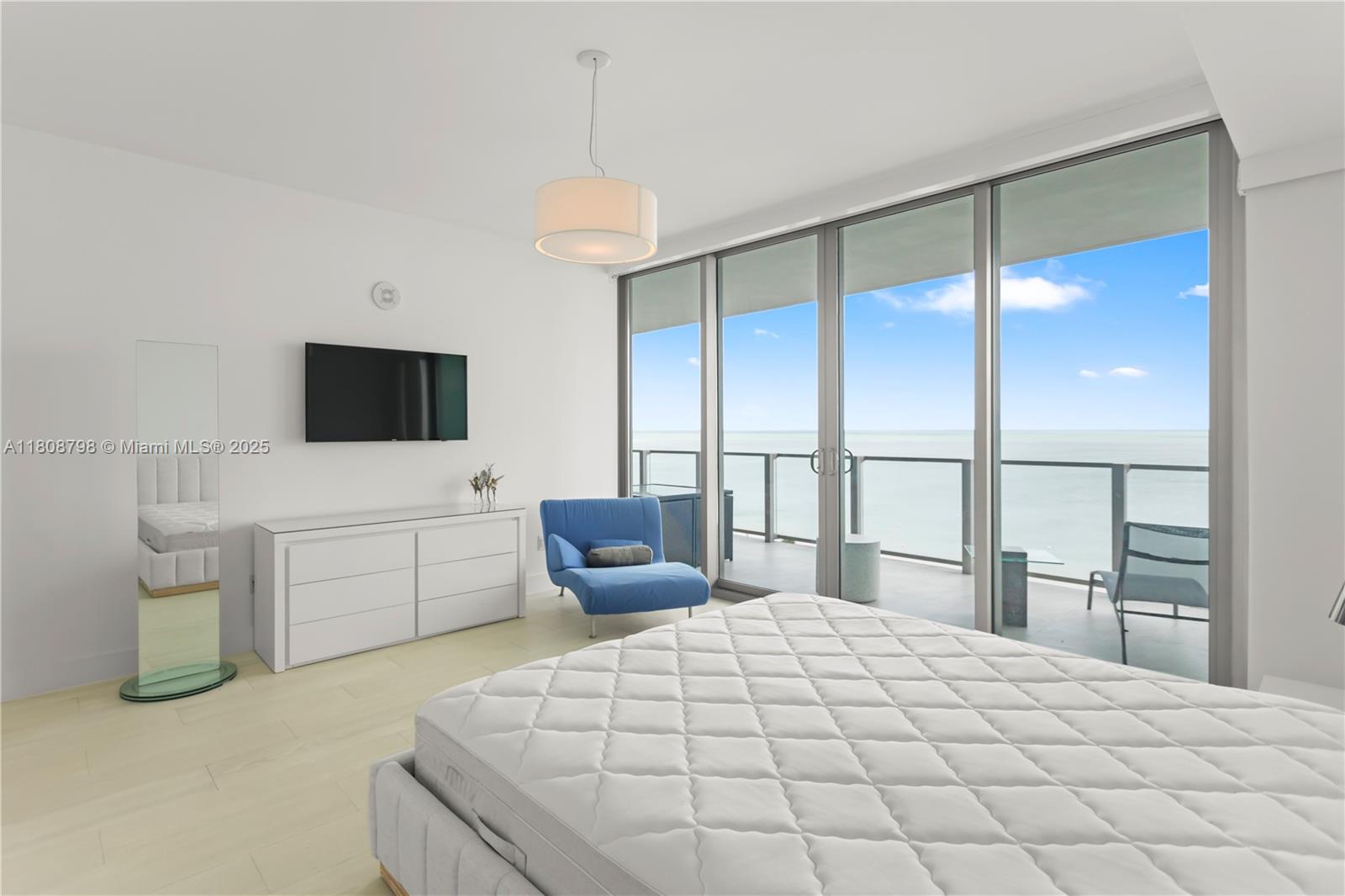 350 Ocean Drive, Unit 904N Key Biscayne, FL 33149 - Photo 24 of 41 a bedroom with a large bed and a flat tv screen