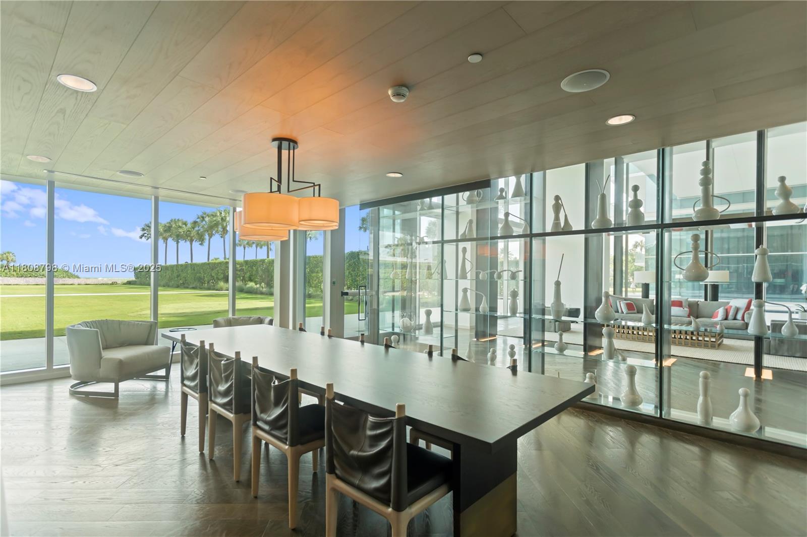 350 Ocean Drive, Unit 904N Key Biscayne, FL 33149 - Photo 4 of 41 a dining room with furniture water view and a floor to ceiling window