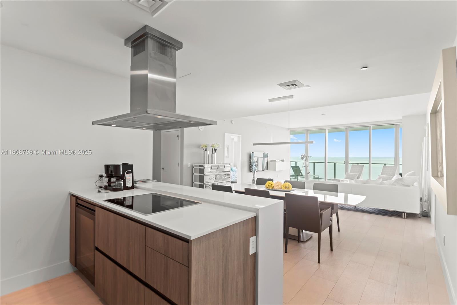 350 Ocean Drive, Unit 904N Key Biscayne, FL 33149 - Photo 5 of 41 a kitchen that has a lot of cabinets a sink and a stove in it