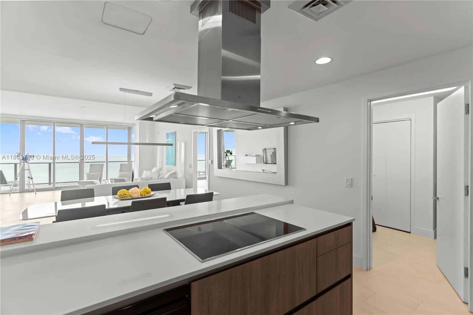 350 Ocean Drive, Unit 904N Key Biscayne, FL 33149 - Photo 6 of 41 a kitchen with stainless steel appliances a sink stove and cabinets