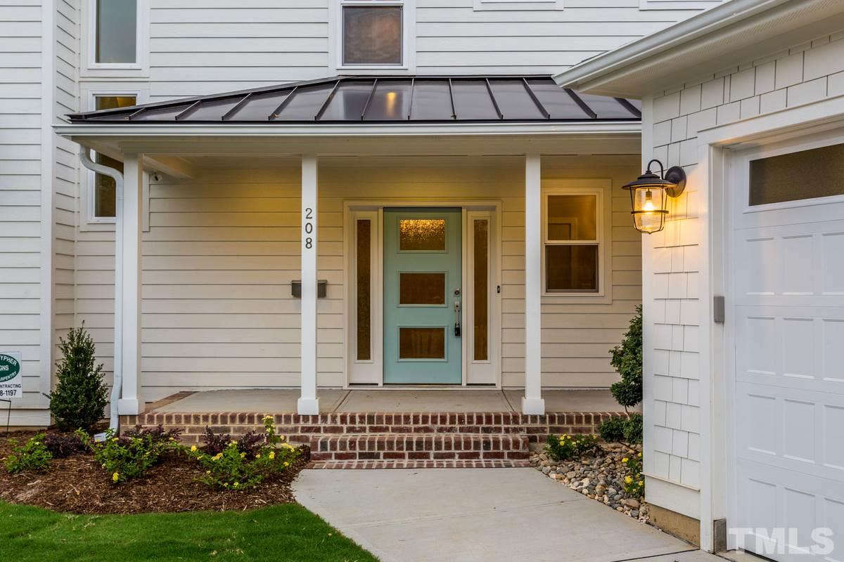 208 Bladen Street Raleigh, NC 27601 - Photo 2 of 25 a front view of a house with a garden