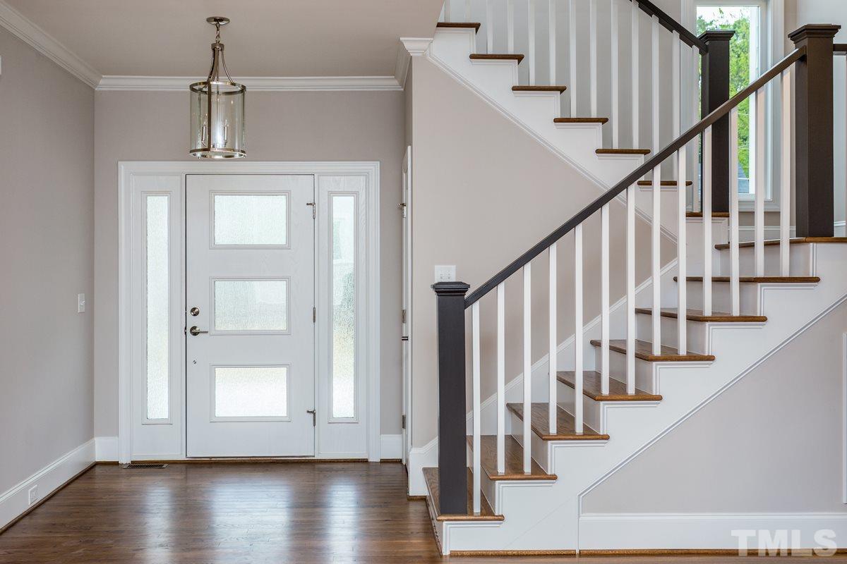 208 Bladen Street Raleigh, NC 27601 - Photo 11 of 25 a view of staircase with wooden floor and staircase