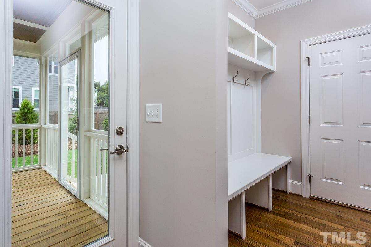 208 Bladen Street Raleigh, NC 27601 - Photo 13 of 25 a view of a hallway with wooden floor and staircase