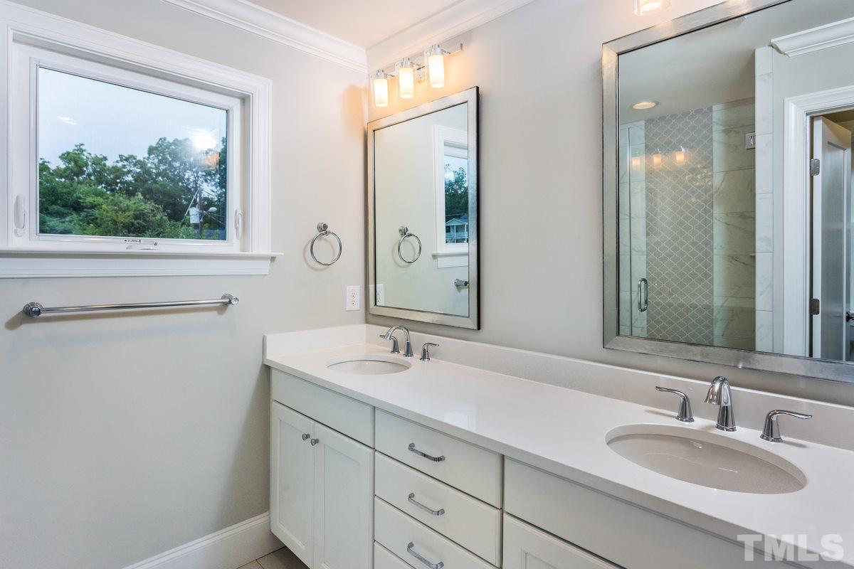 208 Bladen Street Raleigh, NC 27601 - Photo 15 of 25 a bathroom with 2 sink and a mirror