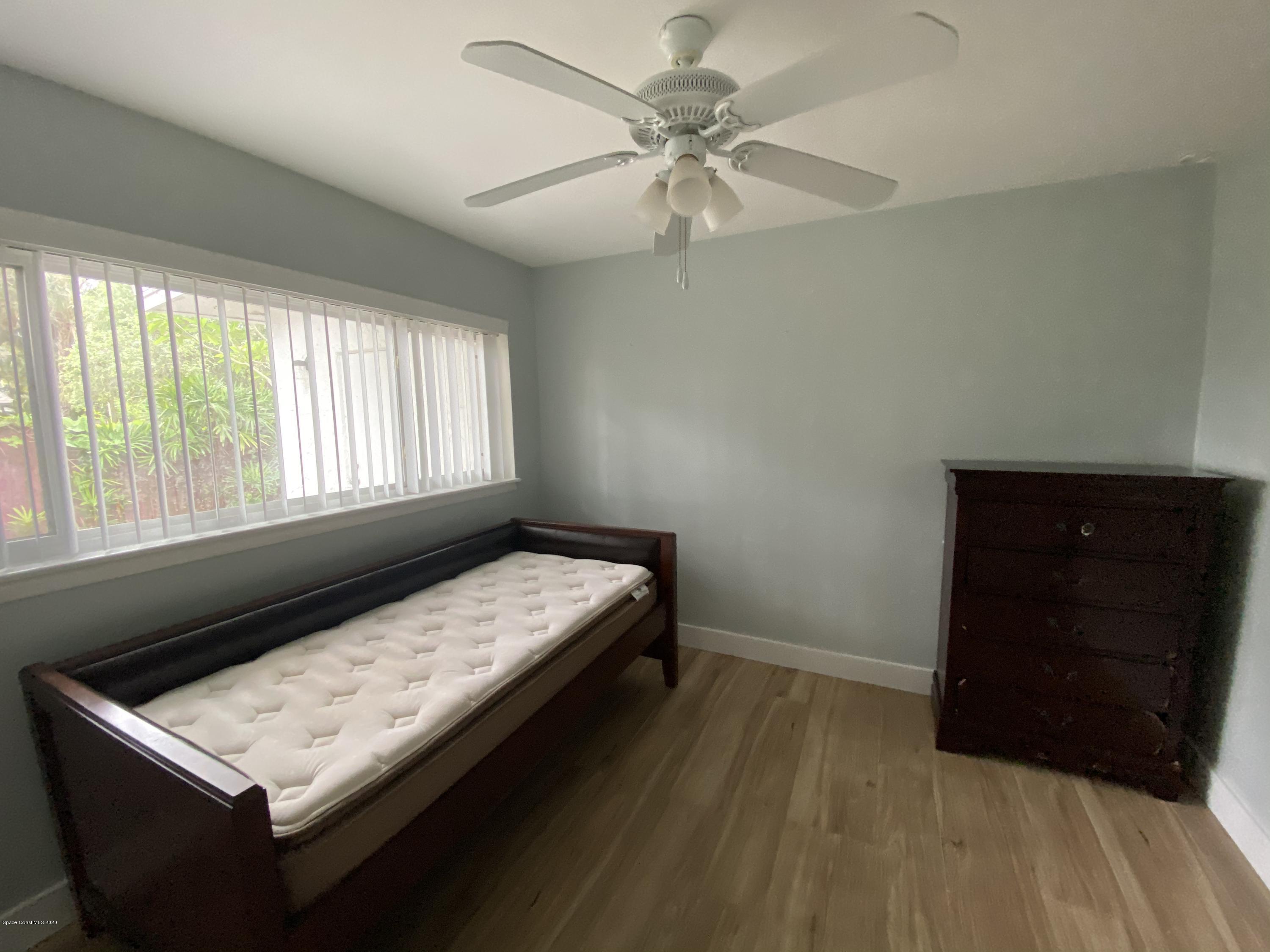 2309 Country Club Road Melbourne, FL 32901 - Photo 22 of 50 a bedroom with a bed and a window