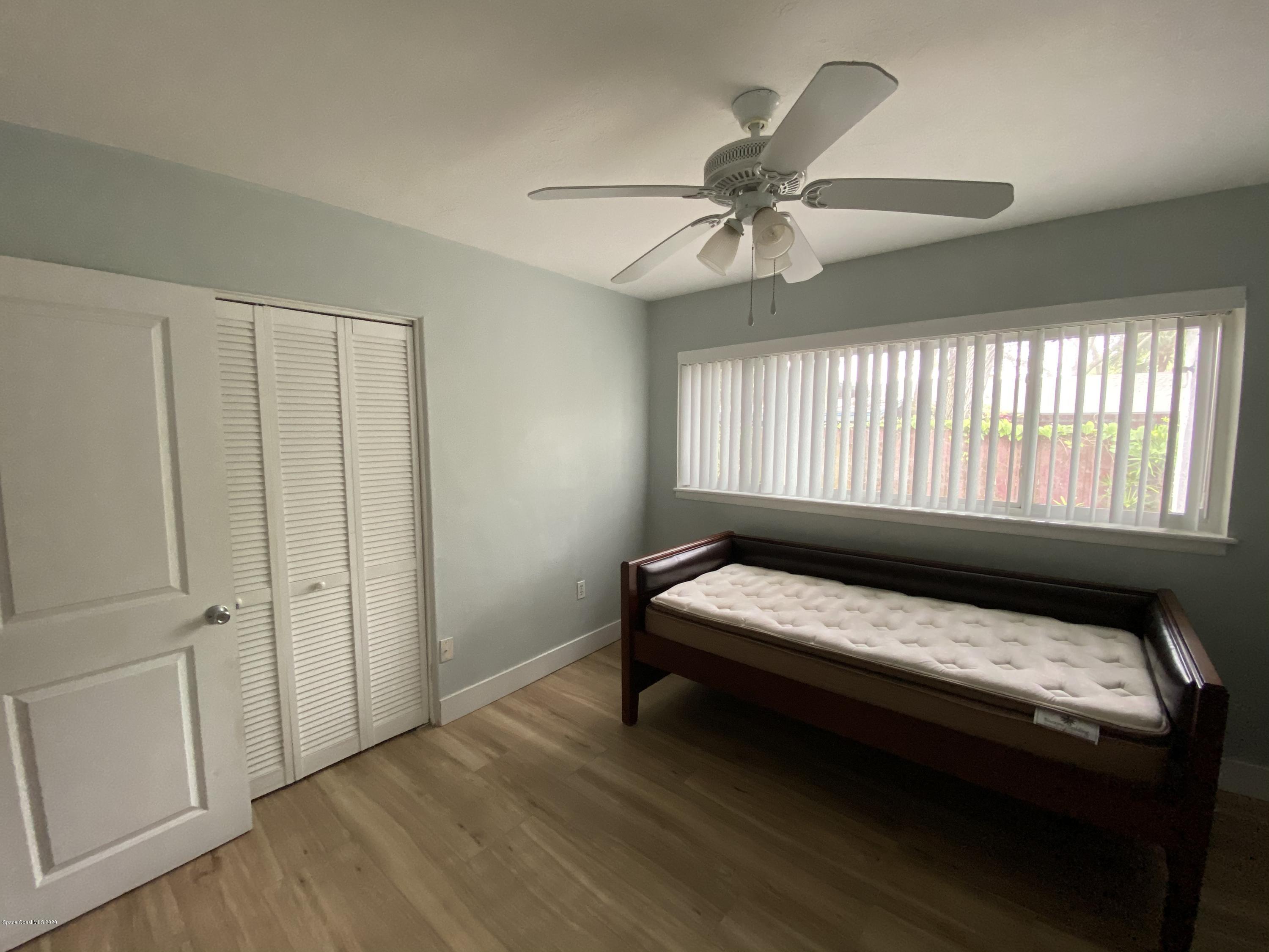 2309 Country Club Road Melbourne, FL 32901 - Photo 23 of 50 a bedroom with a bed and a window