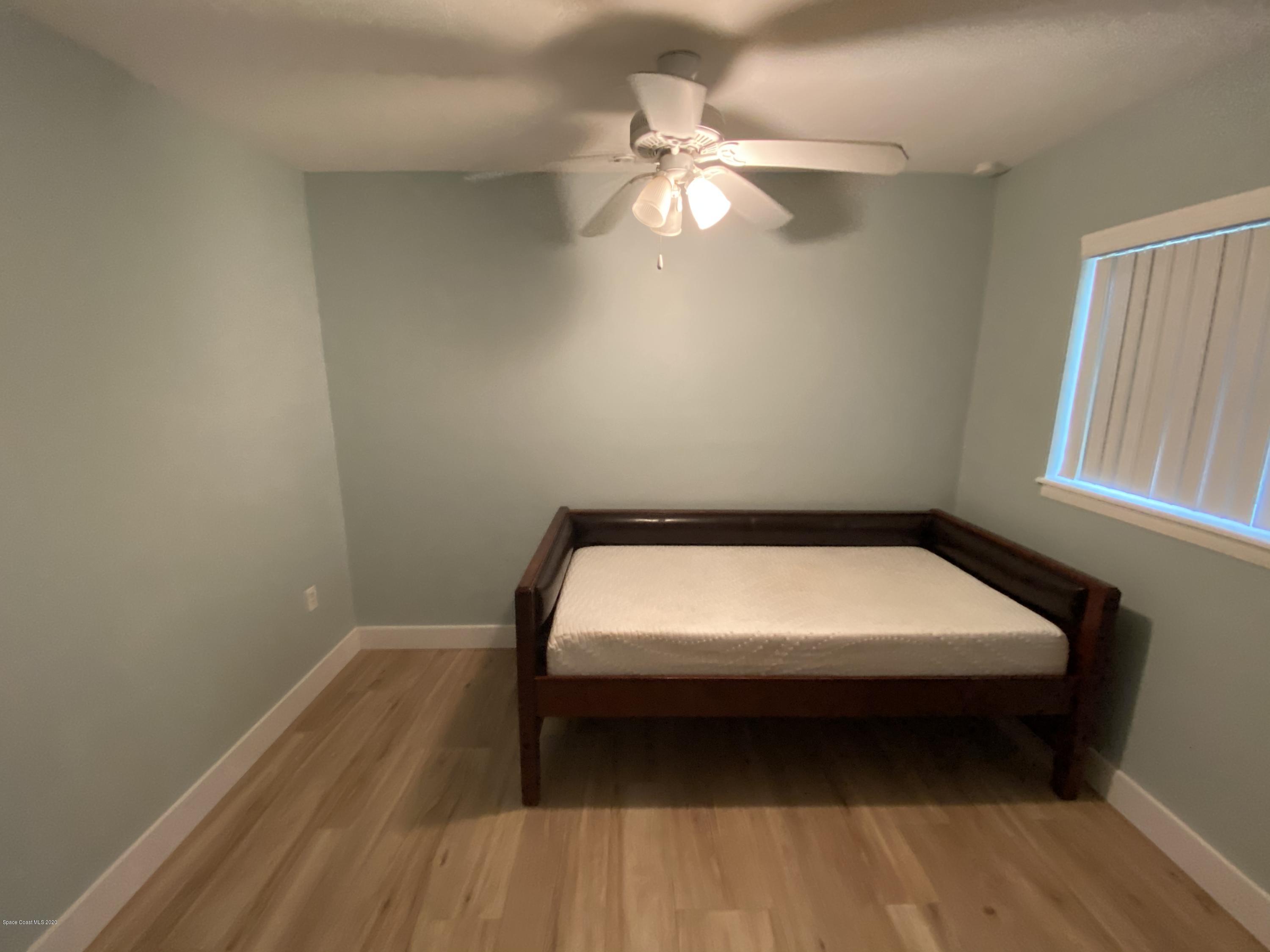 2309 Country Club Road Melbourne, FL 32901 - Photo 27 of 50 a room with a bed and a window