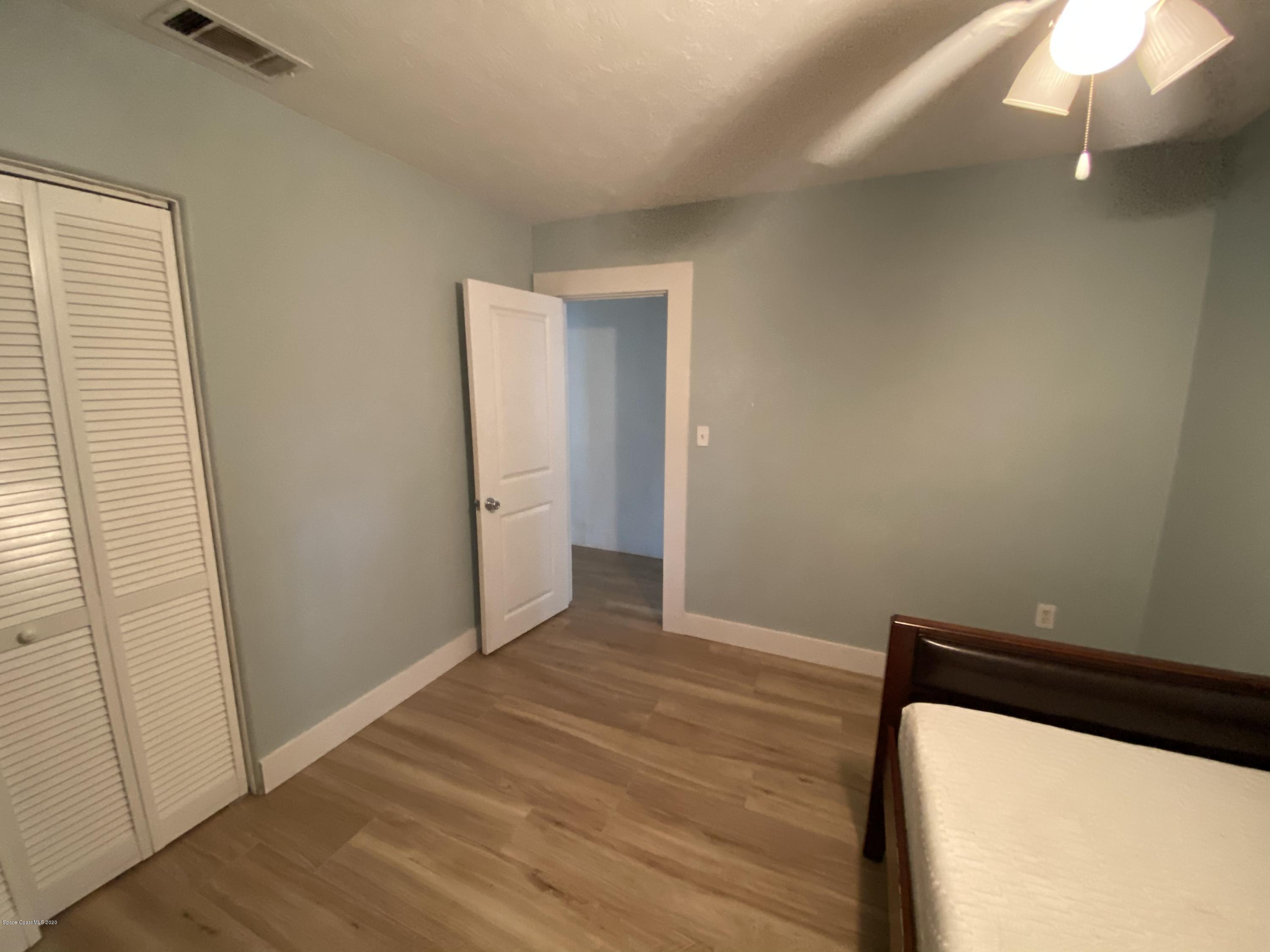 2309 Country Club Road Melbourne, FL 32901 - Photo 28 of 50 a view of a room with wooden floor