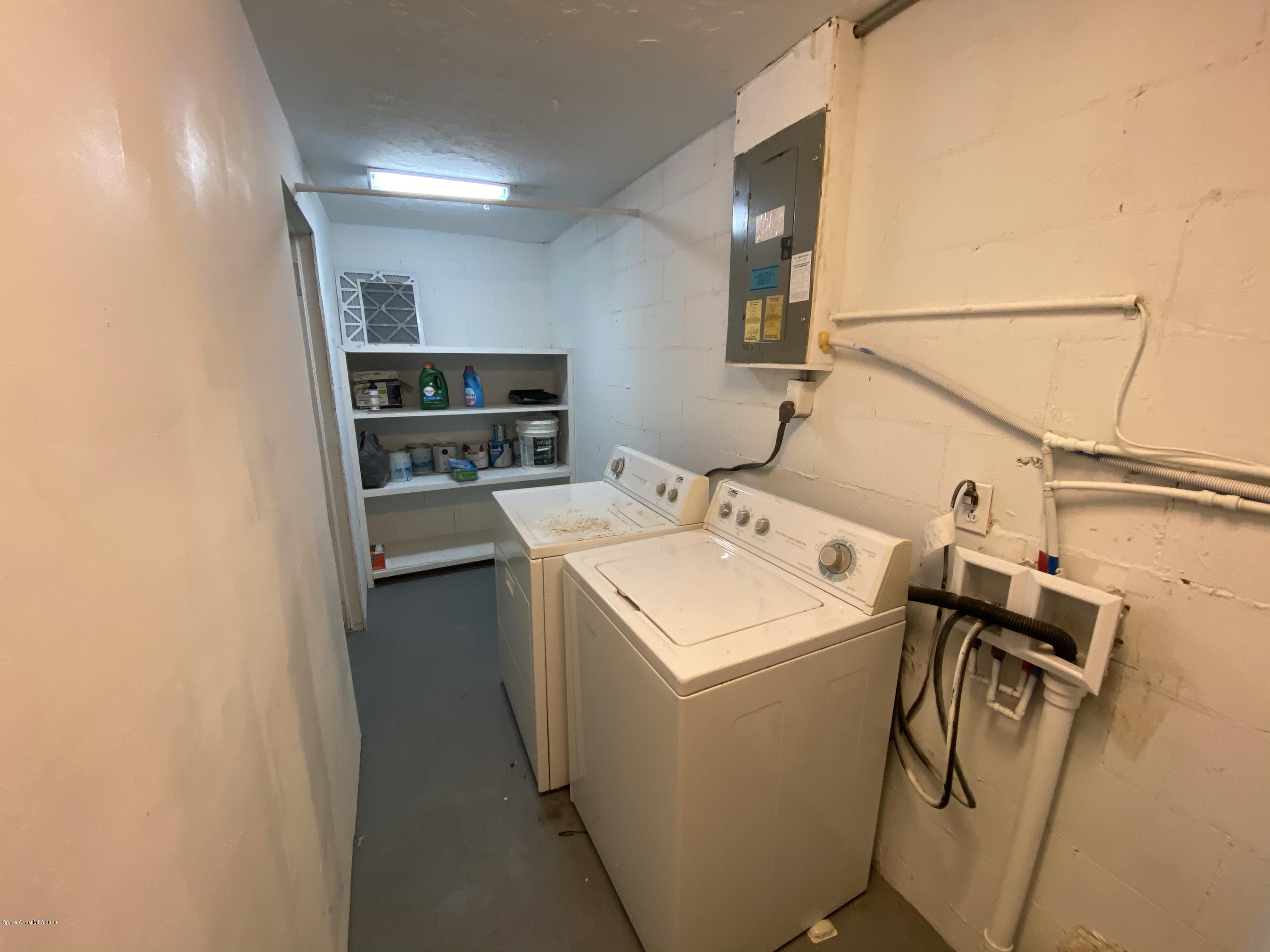 2309 Country Club Road Melbourne, FL 32901 - Photo 38 of 50 a utility room with dryer and washer