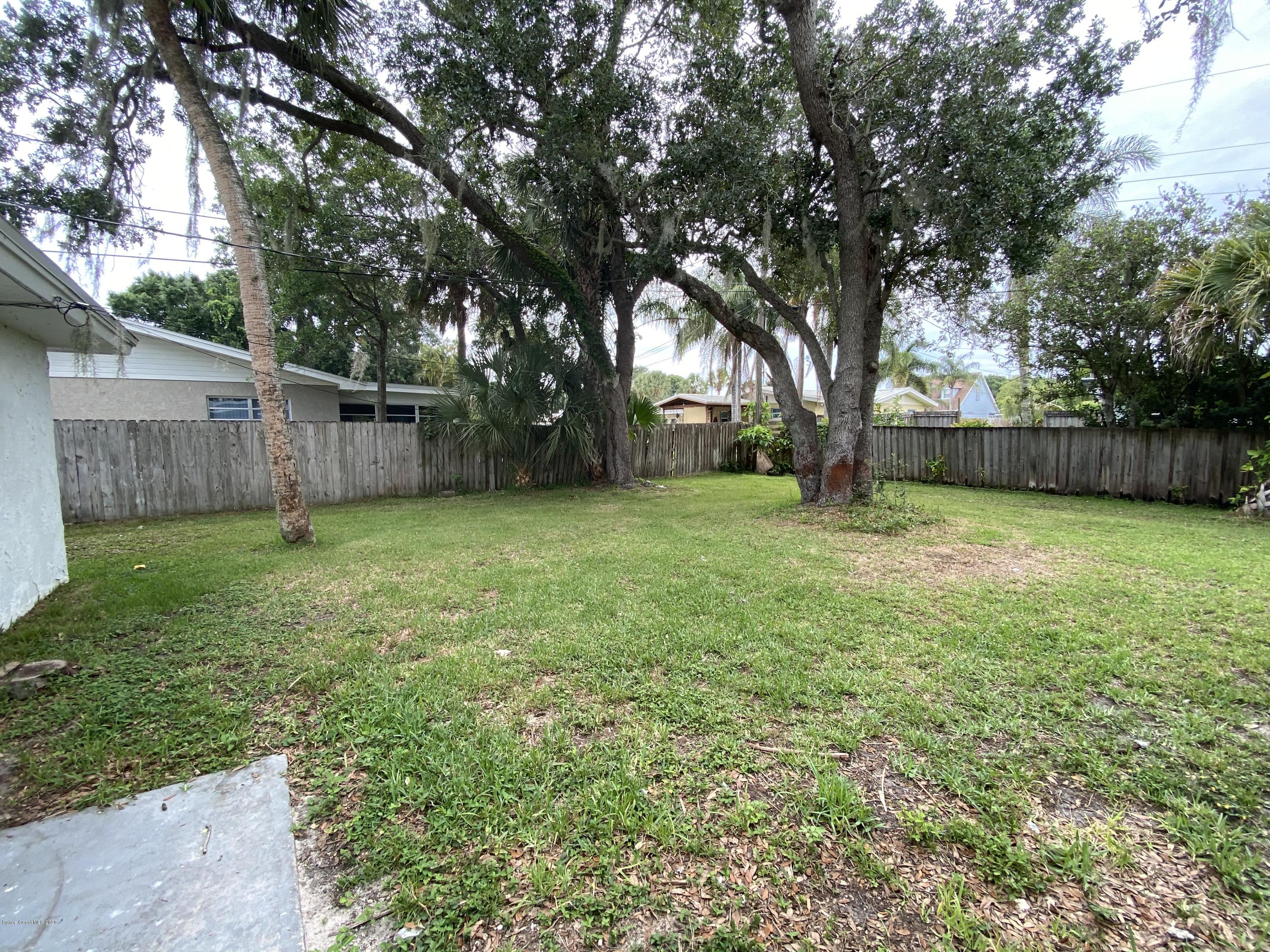2309 Country Club Road Melbourne, FL 32901 - Photo 40 of 50 a view of a backyard with a small cabin
