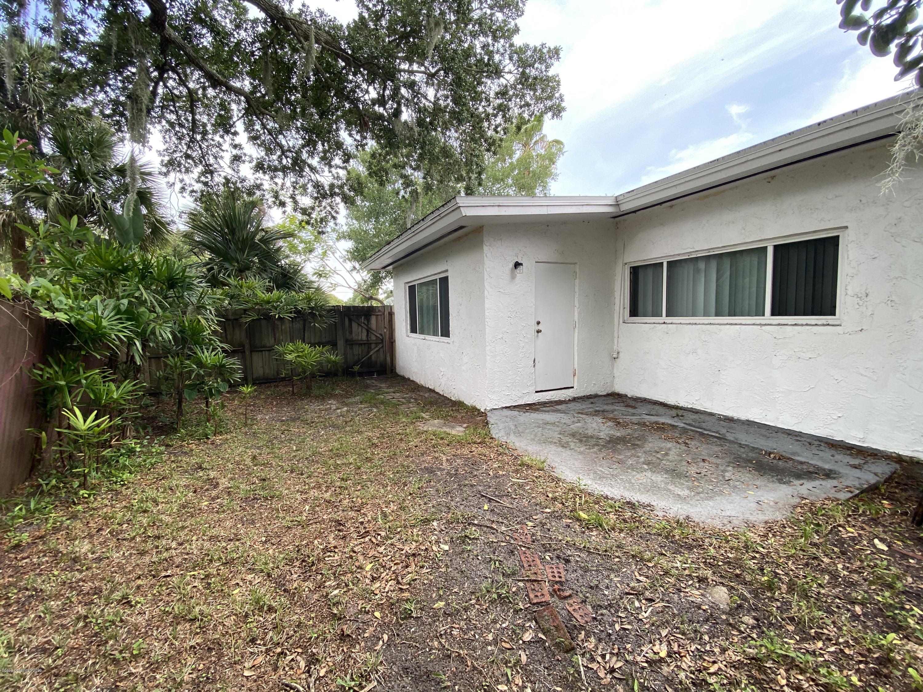 2309 Country Club Road Melbourne, FL 32901 - Photo 44 of 50 a view of a house with a backyard