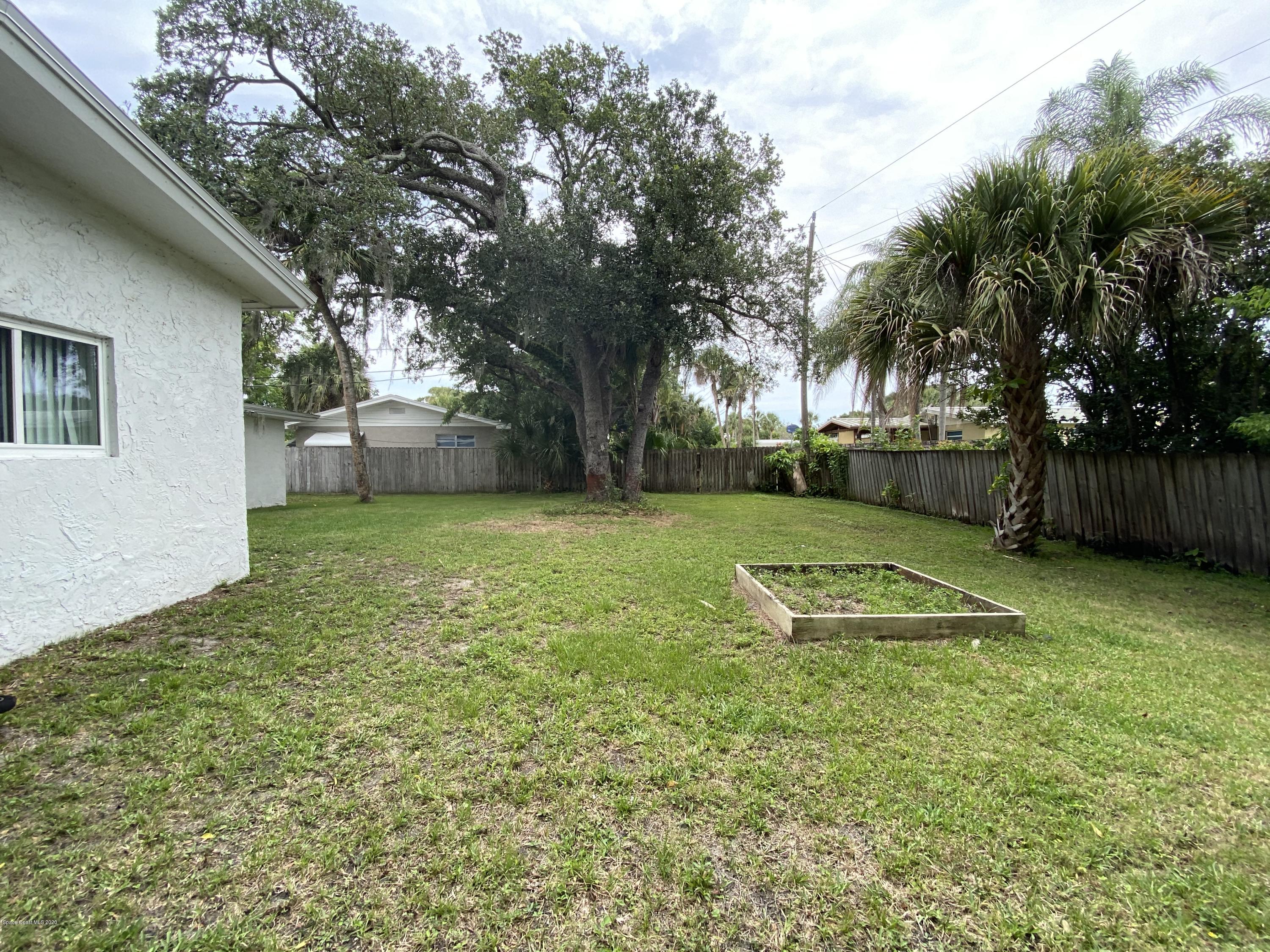 2309 Country Club Road Melbourne, FL 32901 - Photo 45 of 50 a view of a backyard with a garden