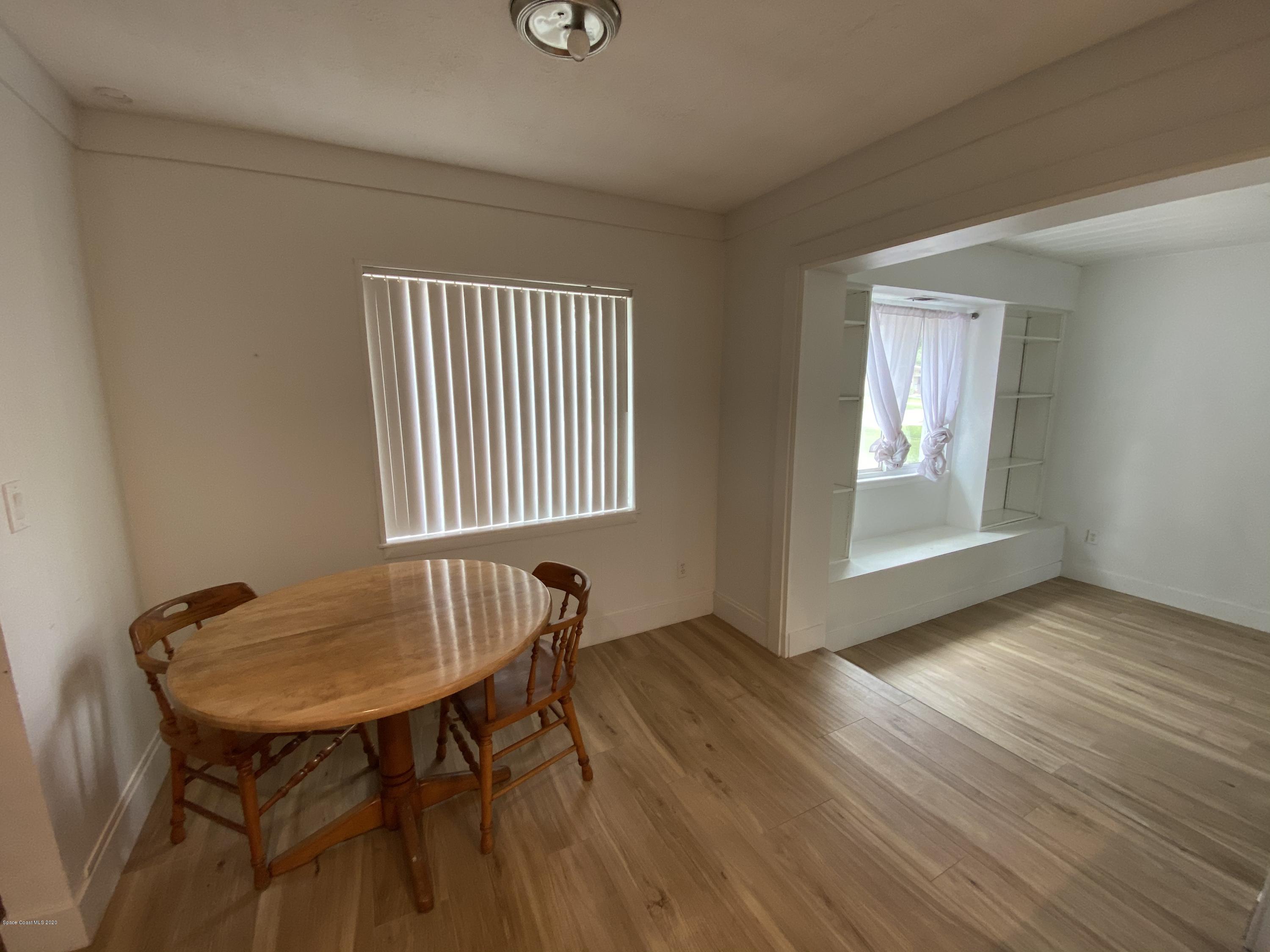 2309 Country Club Road Melbourne, FL 32901 - Photo 8 of 50 a view of a room that has a table and chair in it